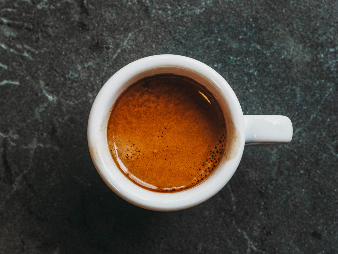 A cup of espresso with crema made using Lavazza Super Crema - the best espresso beans if looking for a crema