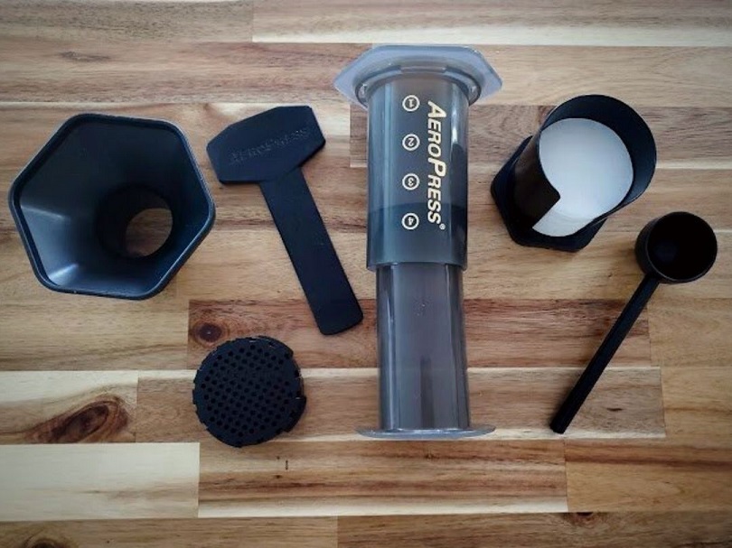AeroPress coffee maker with included accessories