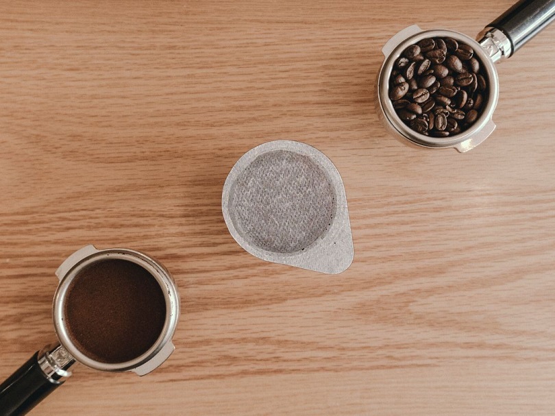 Ground coffee, ESE Coffee Pod, and Whole Coffee Beans Sitting Side-by-side