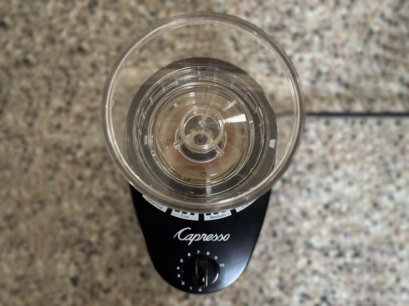 Top down view of the bean hopper and grind adjustment dial of the Capresso Infinity grinder