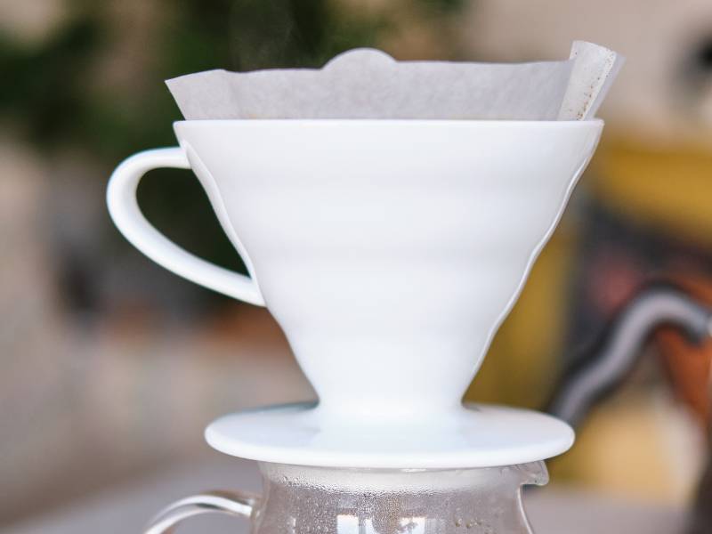 Close up of the Hario V60 - filter inside coffee brewer, on top of carafe