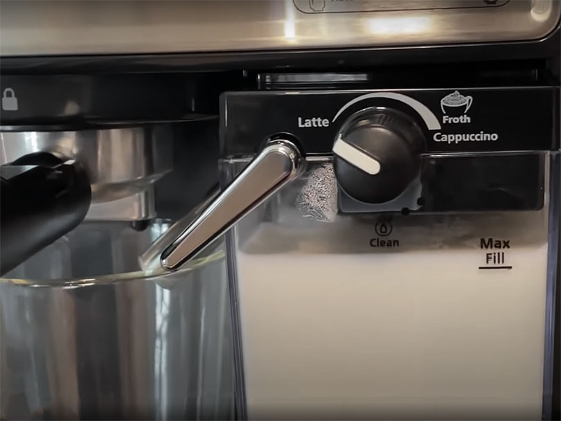 Close up of the Cafe Barista's milk frother