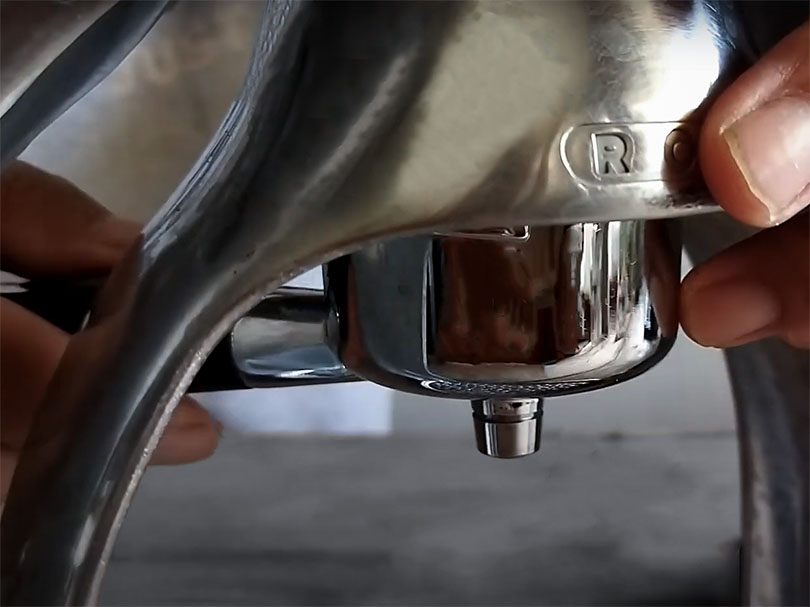 CLose up of the portafilter being put into the ROK GC