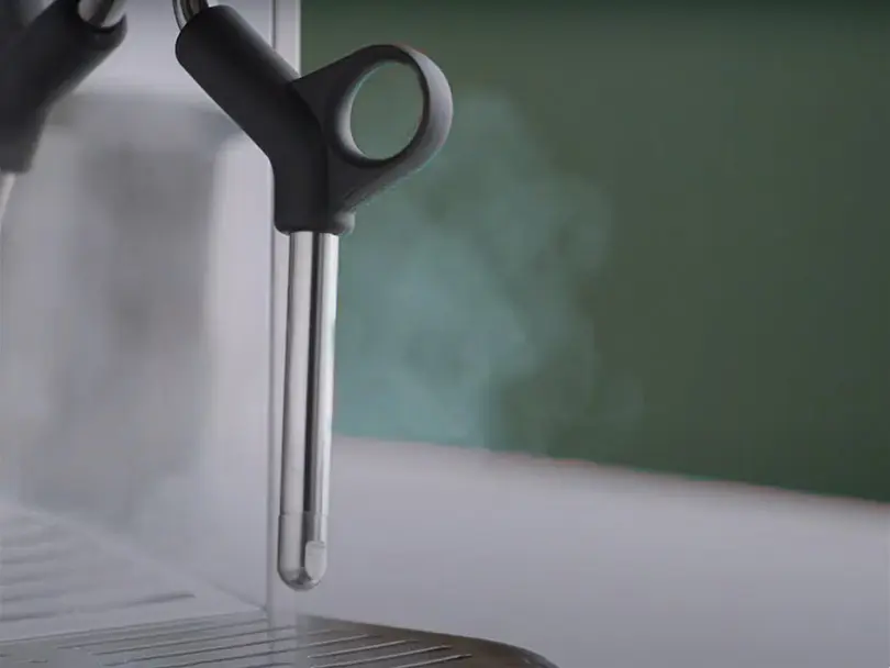 Close up of the single-hole manual milk wand of the Breville Bambino compact espresso machine