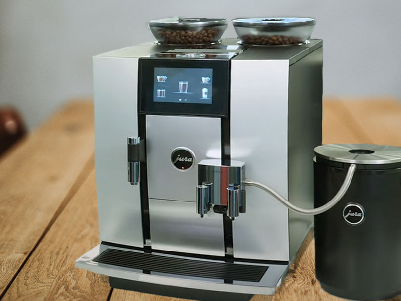 Front-side view of the Jura Giga 6 on wooden table