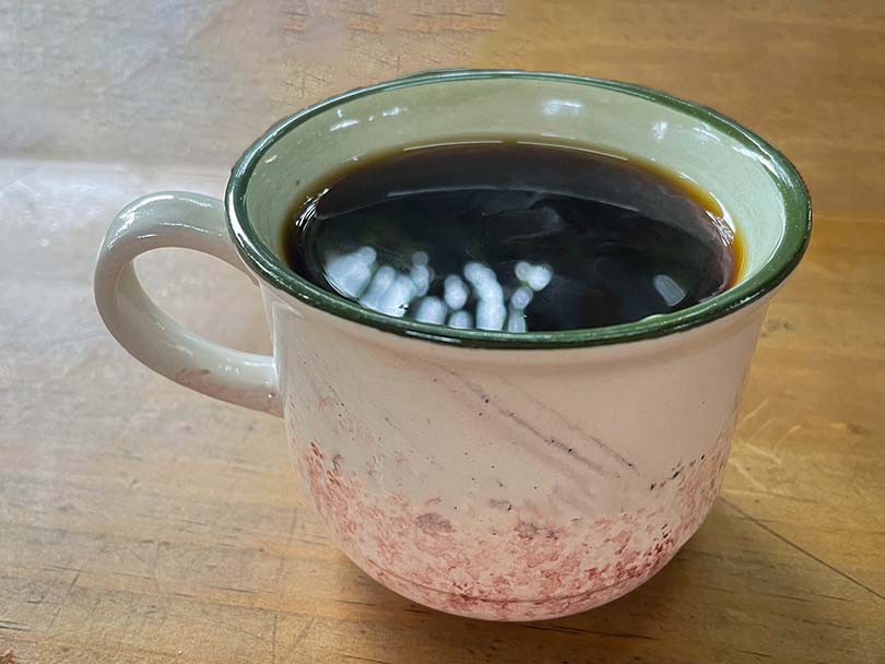 An Americano (espresso topped with hot water) in a pretty mug