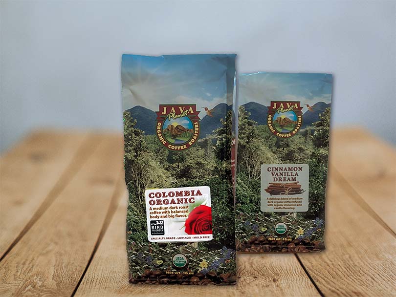 Java Planet coffee beans, Colombia Organic to the front and Cinnamon Vanilla Dream to the back