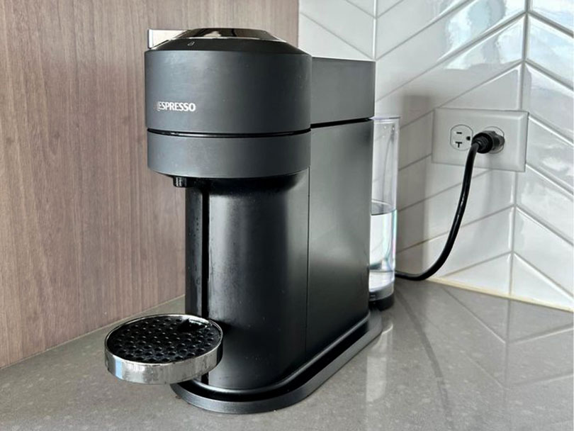 Nespresso Vertuo Next machine plugged into wall