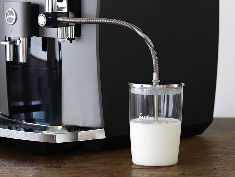 Jura milk container attached to the E8 espresso machine
