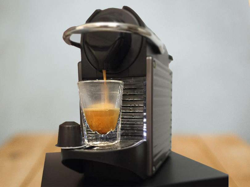 Nespresso Pixie in the process of making a coffee