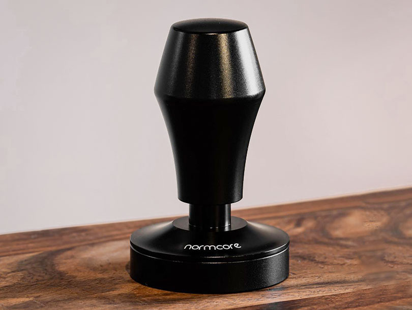 Normcore V4 Tamper on wooden table