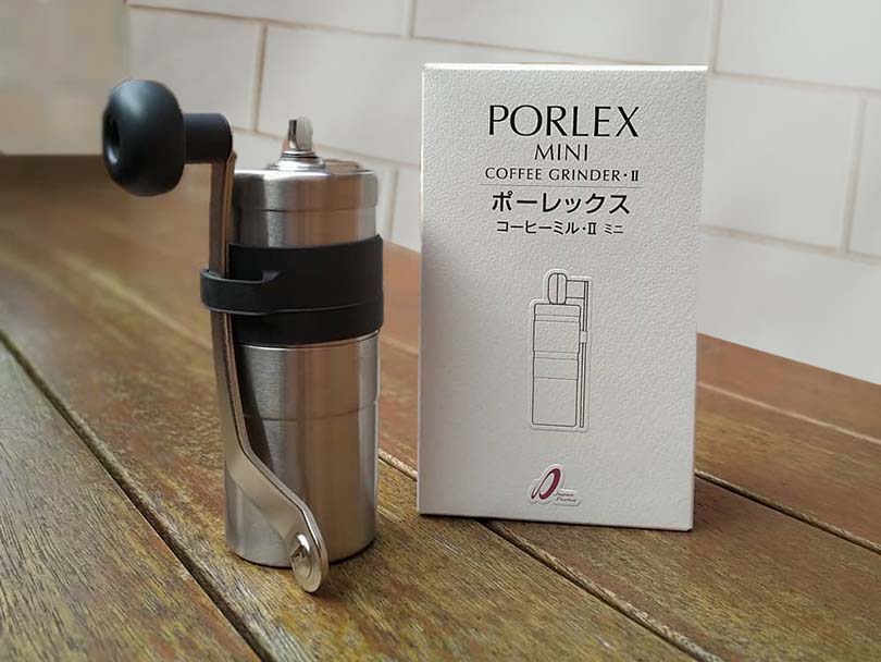 Porlex Mini II on wooden table beside its box