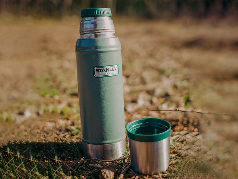Stanley Coffee Thermos sitting in the grass