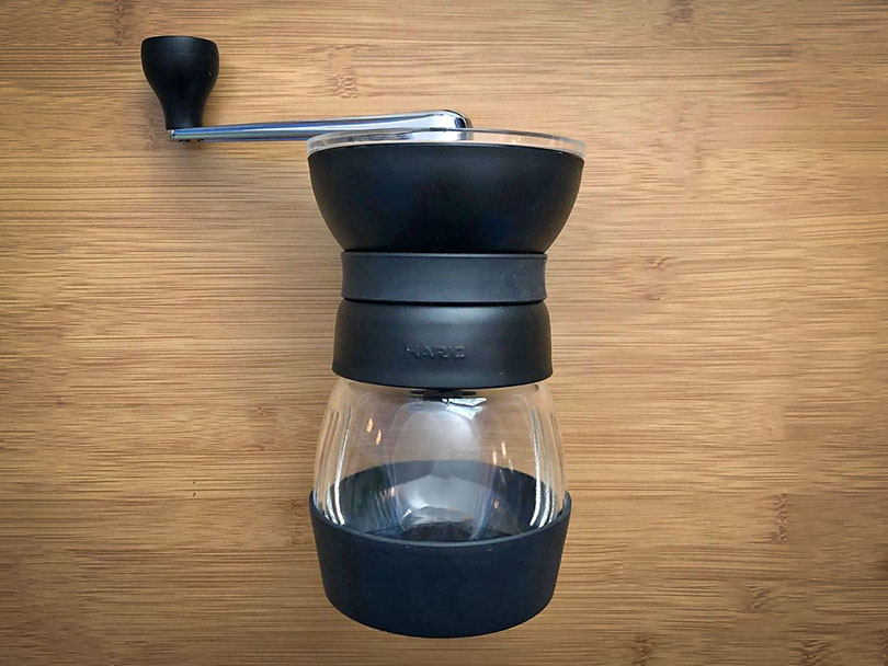 Hario Skerton Pro lying flat on a wooden table