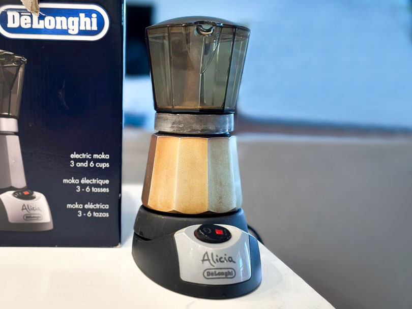 DeLonghi Alicia EMK6 (Electric Moka) sitting on counter in front of the box