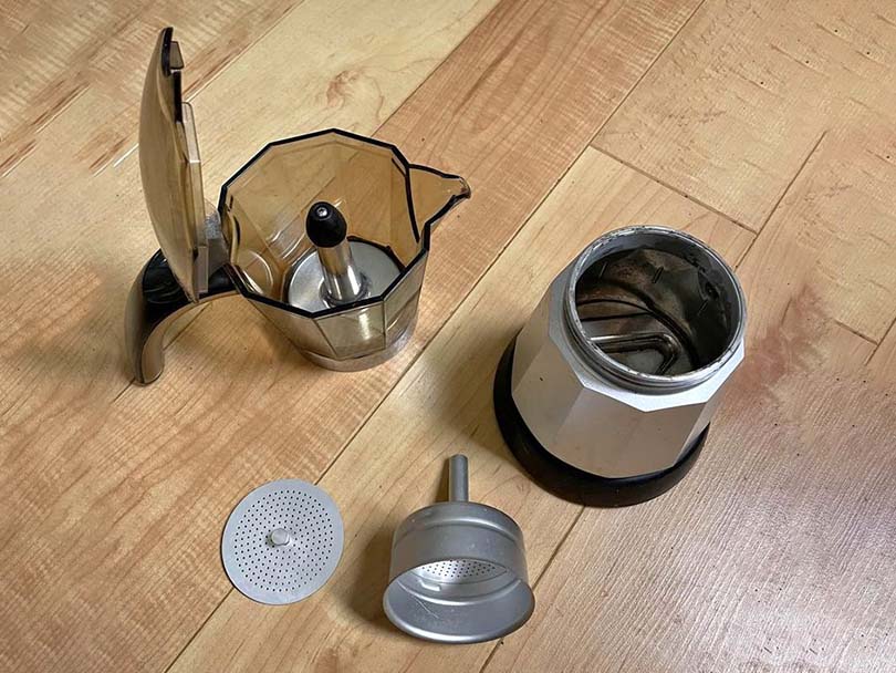 All of the DeLonghi Alicia (EMK6) parts laid out for cleaning