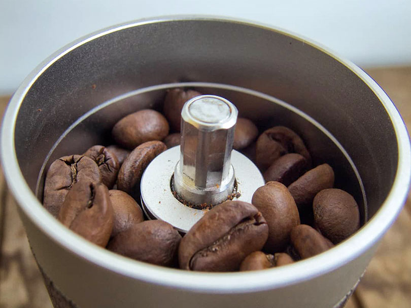 Whole coffee beans in the 1Zpresso Q2's hopper