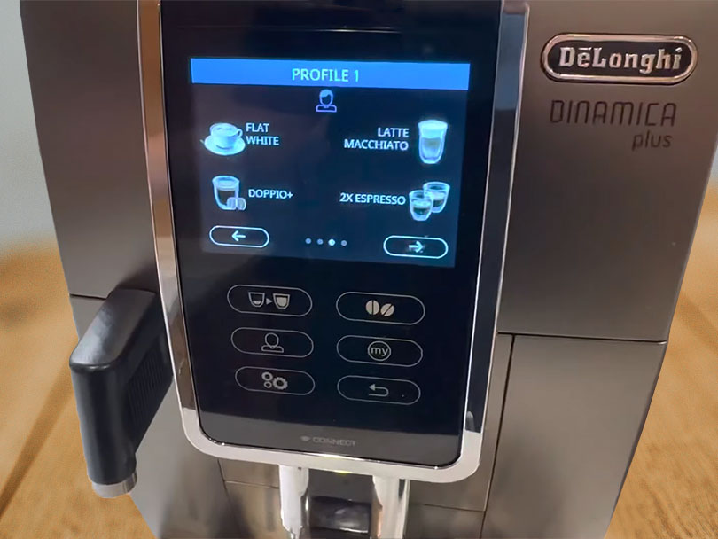 Close-up of the bright screen and buttons on the DeLonghi Dinamica Plus