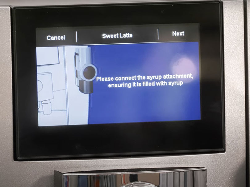 Jura J8 display screen telling user to connect the syrup attachment