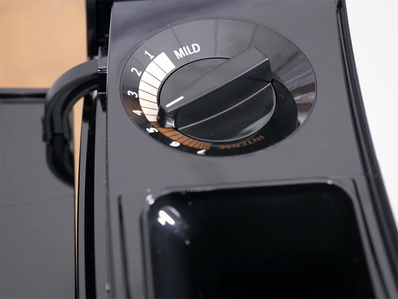 Grind adjustment dial and pre-ground coffee chute on Jura J8