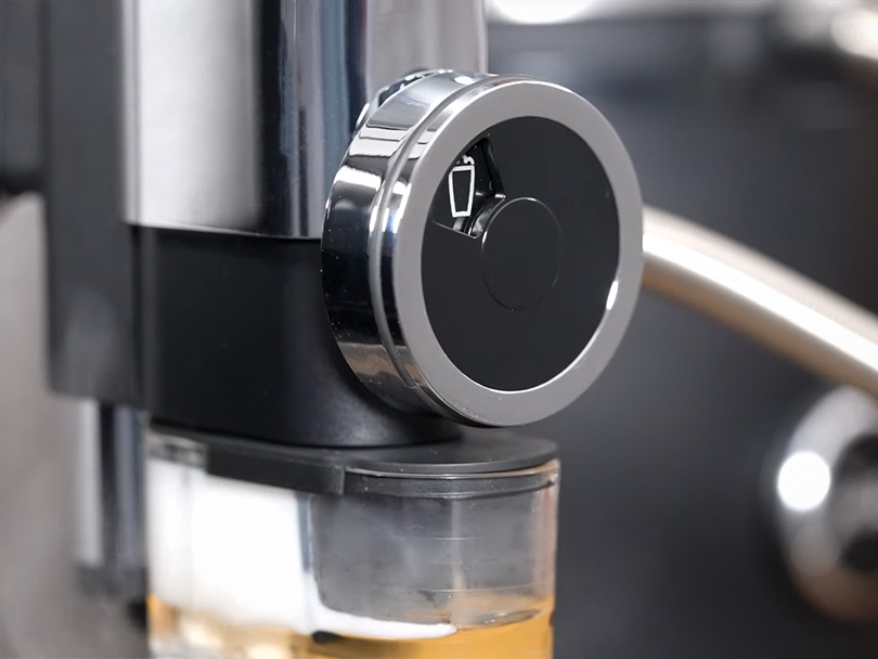 Close-up of the Jura J8's milk adjustment dial