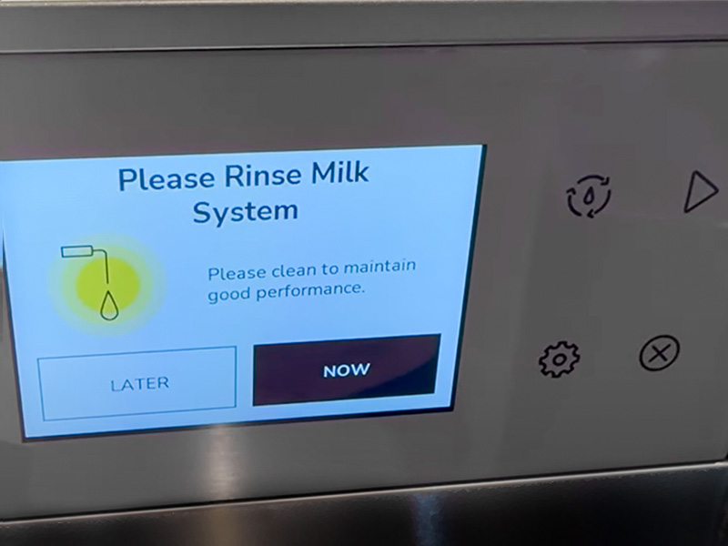 KitchenAid KF7 display screen saying 'Please rinse milk system'