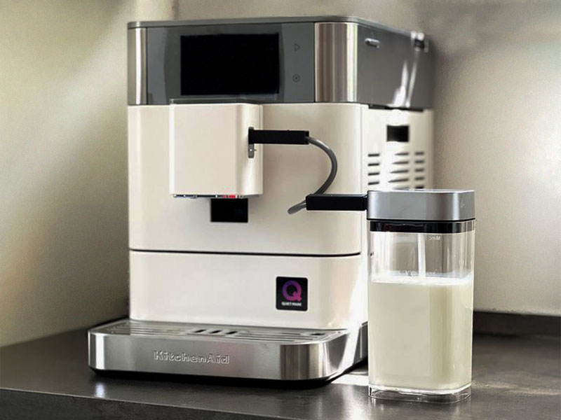 Front view of the KitchenAid KF8 with attached milk container