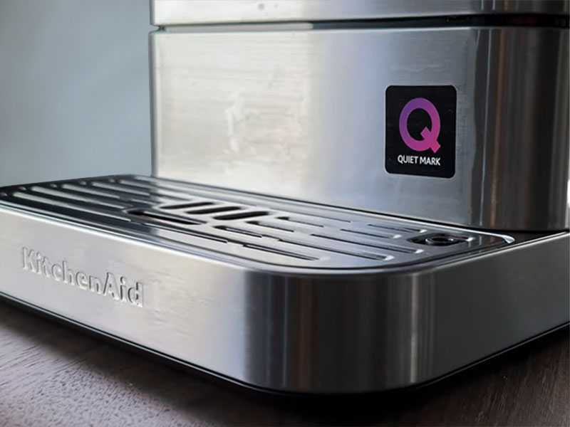 A KitchenAid super-automatic espresso machine with the Quiet Mark clearly visible