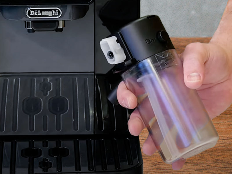 Holding the detached LatteCrema milk container for the DeLonghi Magnifica Start