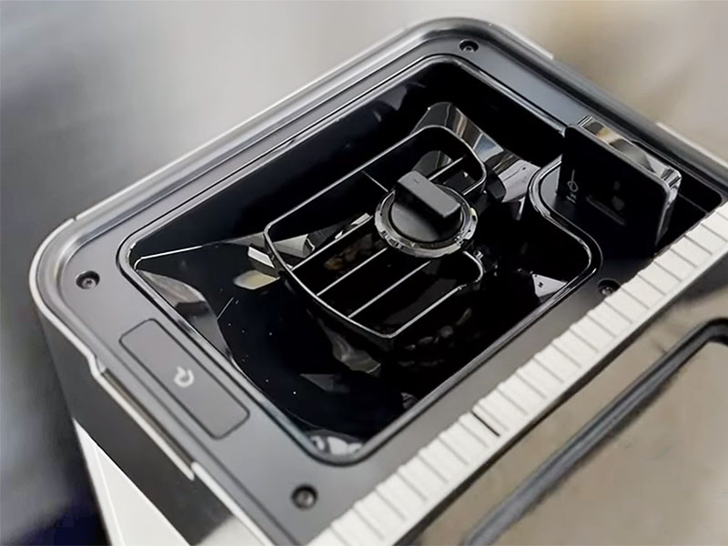 Close up of the bean hopper in the KitchenAid KF9 including removable hopper and pre-ground coffee chute (opened)