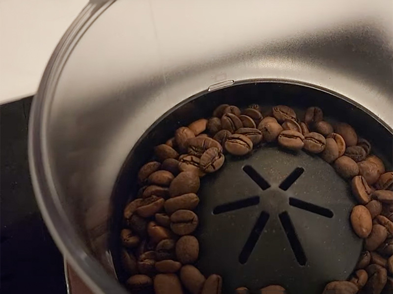 Looking inside the Rivelia's bean hopper before switching it out for the interchangeable one