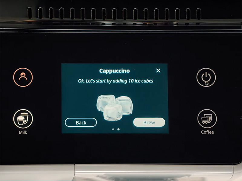 Close-up to the DeLonghi Rivelia screen prompting user to add 10 ice cubes for an iced cappuccino