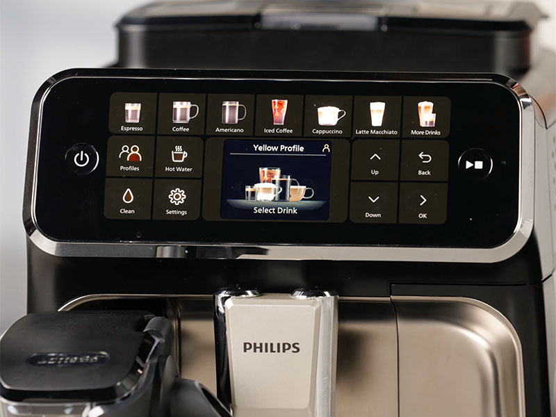 Close-up of the top half of the Philips 4400 with the user interface turned on, displaying the Yellow Profile, prompting user to Select Drink