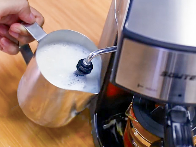Frothing milk using the Sowtech espresso machine's steam wand