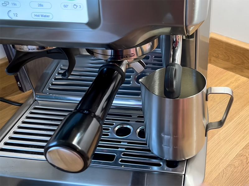 Breville Barista Touch - milk jug is right next to the portafilter