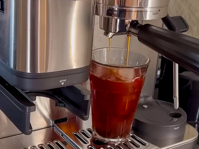 Cold brew coffee being made into a glass with ice with the Ninja Luxe Cafe Pro