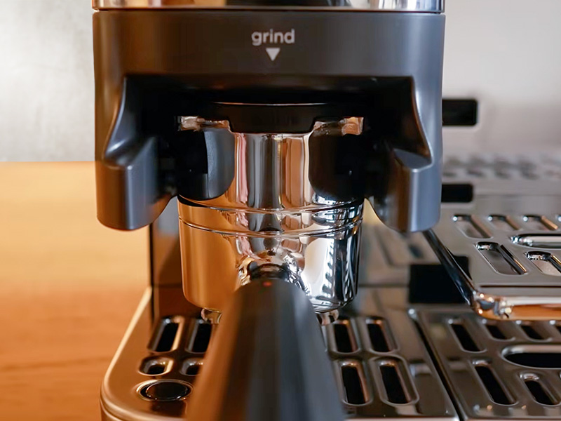 Portafilter for the Ninja Luxe Cafe Pro sitting underneath the grinder