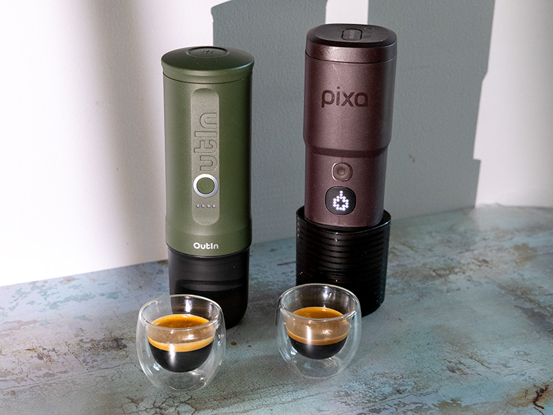 OutIn Nano and Wacaco Pixapresso sitting on table, each has a shot of freshly made espresso in front of it