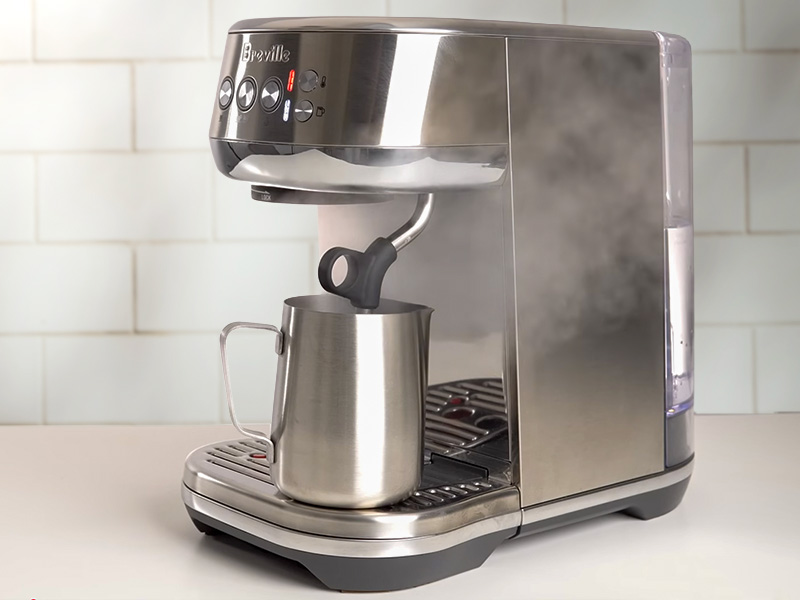 Breville Bambino Plus surrounded by steam