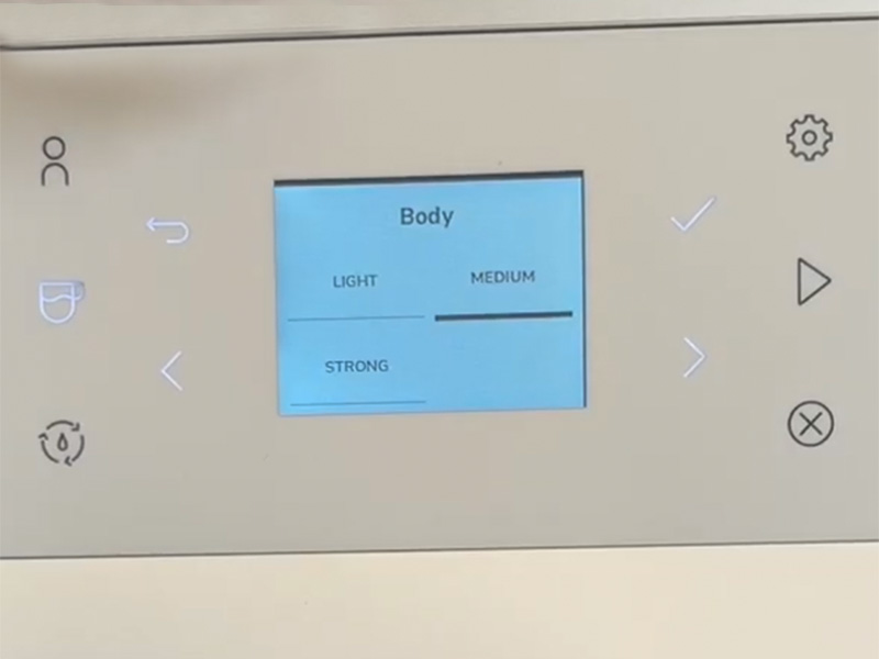 Close-up of the Body settings screen on the KitchenAid KF3. There are 3 options: light, medium, strong. Medium is highlighted
