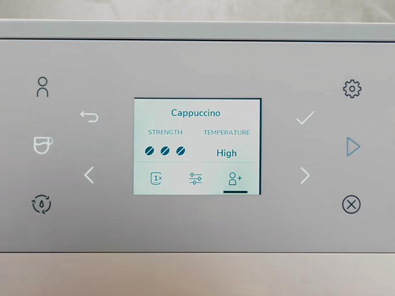 Close-up of the settings for a cappuccino on the KitchenAid KF3 - Strength set to 3 (highest), and Temperature set to High