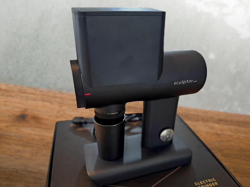Timemore Sculptor 064s electric grinder sitting on top of its box